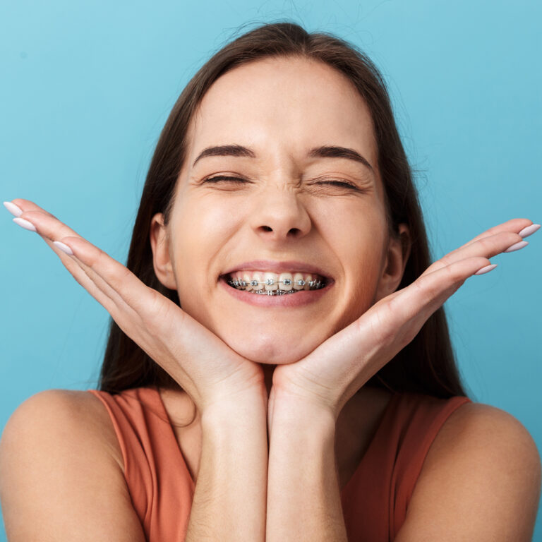 Smiling Teen Girl With Eyes Closed Wearing Braces