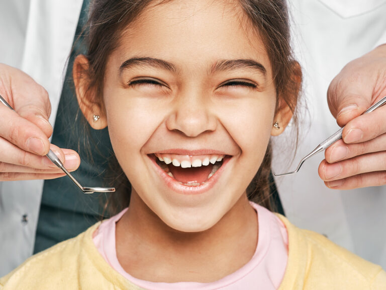 Smiling Young Girl With Orthodontist
