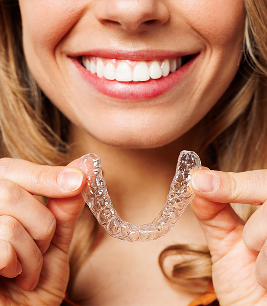 Woman Holding Clear Retainer